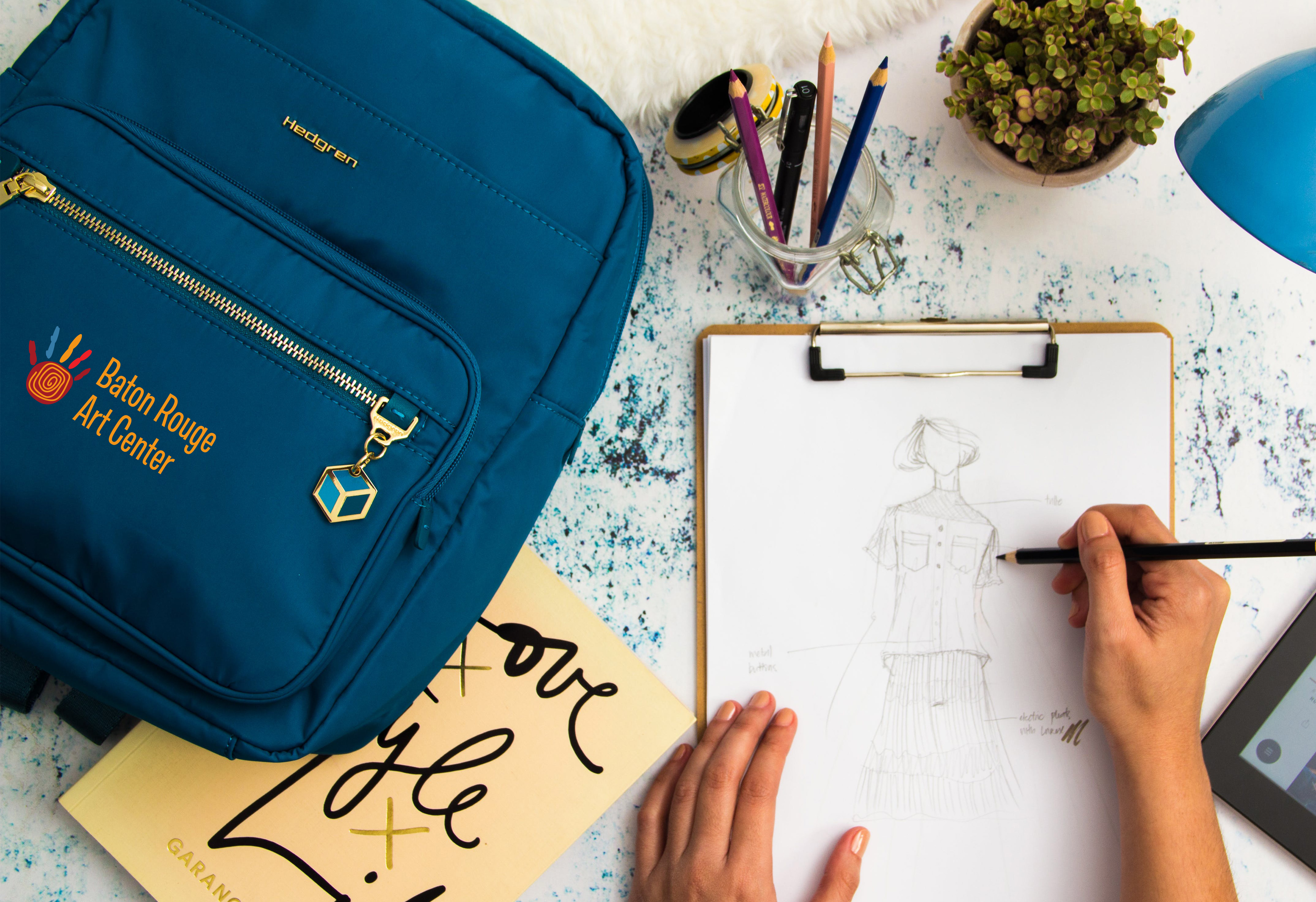 Person drawing next to custom printed backpack