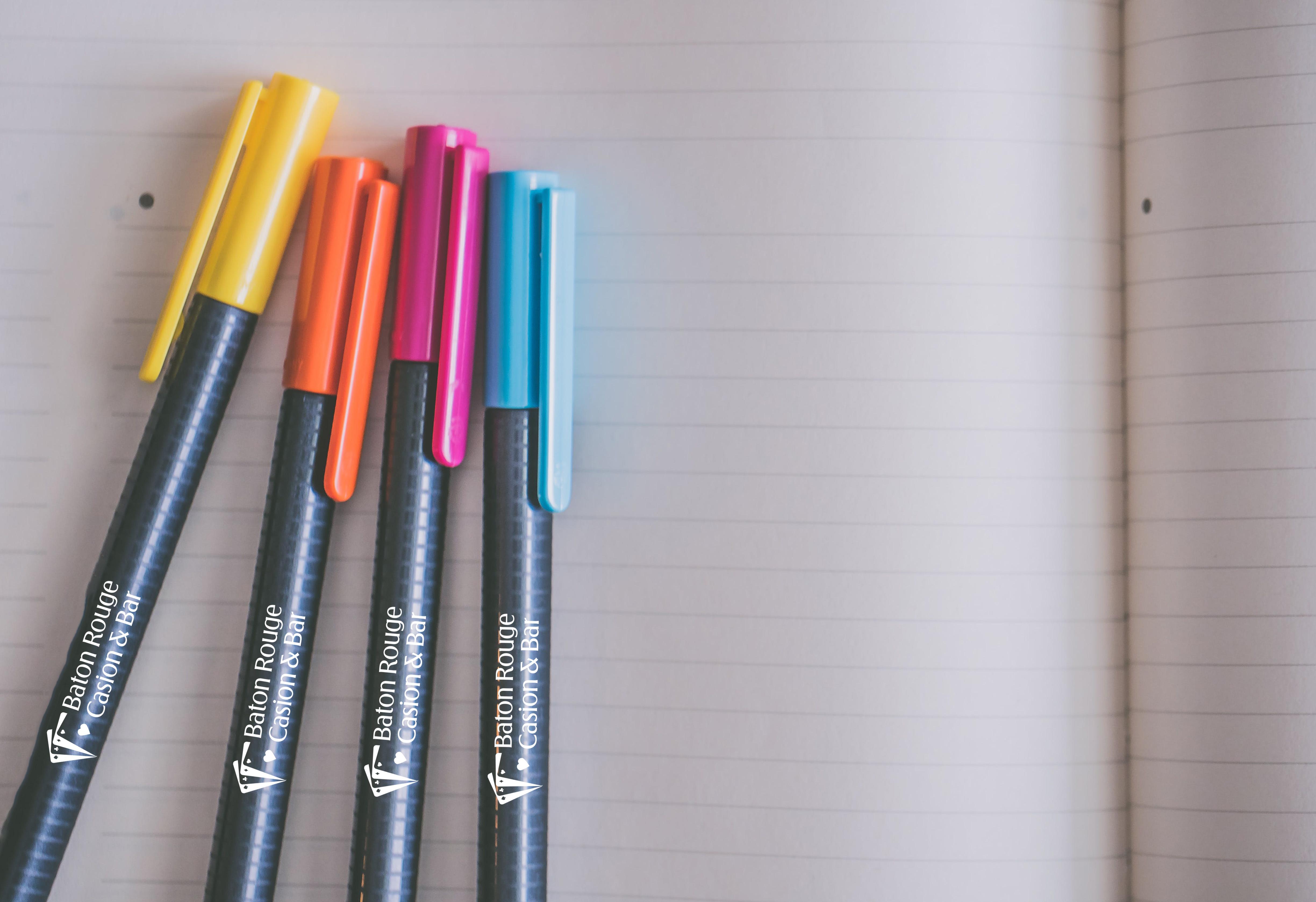 Pens lying on notepad